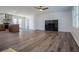 Living room with a fireplace and hardwood floors that connects to a kitchen at 280 Hitchcock Rd, Dallas, GA 30157