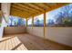 Covered porch with wood flooring and exposed rafters at 280 Hitchcock Rd, Dallas, GA 30157