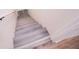 Basement stairway with grey steps and exposed ceiling at 280 Hitchcock Rd, Dallas, GA 30157