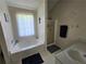 Bright bathroom featuring a soaking tub, vanity, and walk-in shower at 3109 Windgate Dr, Buford, GA 30519