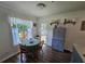 Bright dining area featuring a cozy round table with wooden chairs, lots of natural light, and classic decor at 3109 Windgate Dr, Buford, GA 30519