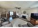 Spacious living room featuring a ceiling fan, fireplace, and neutral colors, perfect for relaxing and entertaining at 3109 Windgate Dr, Buford, GA 30519