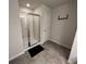 Walk-in shower with glass enclosure, and modern tiled floors at 3615 Hawthorne Terrace, Atlanta, GA 30337
