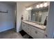 Bathroom featuring double vanity with granite countertop and large mirror at 3615 Hawthorne Terrace, Atlanta, GA 30337