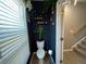 Stylish powder room with floating shelves, decorative plants, and modern lighting fixtures at 3615 Hawthorne Terrace, Atlanta, GA 30337