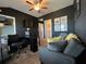 Bedroom features a ceiling fan, black walls, carpet and built-in closet space at 3615 Hawthorne Terrace, Atlanta, GA 30337