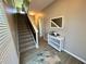 Inviting entryway with stylish console table, stairway, wood floors, and decorative mirror, adding a touch of elegance at 3615 Hawthorne Terrace, Atlanta, GA 30337