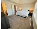 Bright main bedroom with lots of natural light, carpet, and an ensuite bathroom at 3615 Hawthorne Terrace, Atlanta, GA 30337