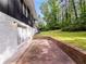 A view of the backyard featuring a patio and lush green lawn at 466 Thackery Sw Pl, Atlanta, GA 30311