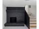 Basement with brick fireplace and stairway at 466 Thackery Sw Pl, Atlanta, GA 30311