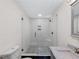 Contemporary bathroom featuring a glass walk-in shower and modern fixtures at 466 Thackery Sw Pl, Atlanta, GA 30311