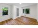 Bright bedroom with hardwood floors and natural light from two large windows at 466 Thackery Sw Pl, Atlanta, GA 30311