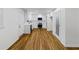 Kitchen area with hardwood floors, white cabinets, and stainless steel appliances at 466 Thackery Sw Pl, Atlanta, GA 30311
