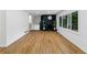 Spacious living room boasting hardwood floors and a cozy black fireplace at 466 Thackery Sw Pl, Atlanta, GA 30311