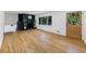 Bright living room features hardwood floors, large window, black fireplace, and natural light at 466 Thackery Sw Pl, Atlanta, GA 30311