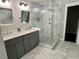 Bright primary bath with double vanity, soaking tub, and glass-enclosed shower at 1255 Plaza Sw Ave, Atlanta, GA 30310