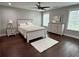 Cozy bedroom with neutral décor and wood-look floors at 1255 Plaza Sw Ave, Atlanta, GA 30310