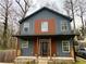 Charming two-story home featuring a modern blue exterior with a covered front porch at 1255 Plaza Sw Ave, Atlanta, GA 30310