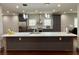 Spacious kitchen island with seating, pendant lighting, and stainless steel appliances at 1255 Plaza Sw Ave, Atlanta, GA 30310