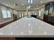 Spacious kitchen island with white quartz countertop and pendant lighting at 1255 Plaza Sw Ave, Atlanta, GA 30310
