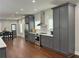 Stylish kitchen showcasing stainless steel appliances, gray cabinetry, and hardwood floors at 1255 Plaza Sw Ave, Atlanta, GA 30310