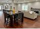 Open-concept living space with hardwood floors and combined dining and living areas at 1255 Plaza Sw Ave, Atlanta, GA 30310
