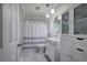 Modern bathroom features vanity storage, subway tile, and stylish shower curtain at 1837 Lochlomand Se Ln, Smyrna, GA 30080