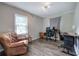 Bedroom with a comfortable chair, desk, and hardwood floors at 1837 Lochlomand Se Ln, Smyrna, GA 30080