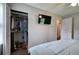 Well-lit bedroom with open closet, TV, and doorway visible from bed at 1837 Lochlomand Se Ln, Smyrna, GA 30080