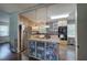 Well-lit kitchen with stainless steel appliances, center island, and stylish pendant lighting at 1837 Lochlomand Se Ln, Smyrna, GA 30080