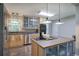 Spacious kitchen with stainless steel appliances, cooktop island, and natural light at 1837 Lochlomand Se Ln, Smyrna, GA 30080