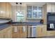 Updated kitchen with stainless steel appliances, and glass-front cabinets at 1837 Lochlomand Se Ln, Smyrna, GA 30080