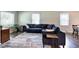 Inviting living room features a large window, comfortable seating, and a stylish decor at 1837 Lochlomand Se Ln, Smyrna, GA 30080