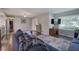 Comfortable living room with hardwood floors, a plush sectional sofa, and large windows for natural light at 1837 Lochlomand Se Ln, Smyrna, GA 30080