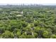 Aerial view of Atlanta homes surrounded by lush, green trees at 1864 Madrona Nw St, Atlanta, GA 30318