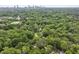 Stunning aerial view showcasing lush green trees and skyline in distance for nature-lovers seeking urban tranquility at 1864 Madrona Nw St, Atlanta, GA 30318