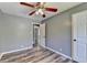 Cozy bedroom with a ceiling fan, neutral walls, and modern flooring, offering a comfortable and inviting space at 4751 Shay Ter, Buford, GA 30519