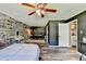 Spacious bedroom with whitewashed brick, wood floors, and natural light at 4751 Shay Ter, Buford, GA 30519
