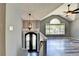 Foyer with stairway featuring decorative front door and large arched window at 4751 Shay Ter, Buford, GA 30519