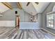 Open-concept living space with vaulted ceilings, a sleek fireplace, and a seamless transition to other living areas and dining space at 4751 Shay Ter, Buford, GA 30519