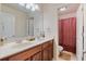 Bathroom featuring double sinks, granite counters, and separate water closet with shower/tub at 3476 Bridge Walk Drive, Lawrenceville, GA 30044