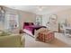 Cozy bedroom featuring neutral walls, plush carpet, and a comfortable bed with a decorative bench at 3476 Bridge Walk Drive, Lawrenceville, GA 30044