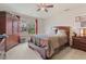Comfortable bedroom with a large bed, dresser, and a view of the outside at 3476 Bridge Walk Drive, Lawrenceville, GA 30044