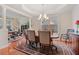 Open concept dining area with hardwood floors and access to office at 3476 Bridge Walk Drive, Lawrenceville, GA 30044