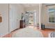 Bright foyer featuring hardwood floors, decorative rug and stylish entryway at 3476 Bridge Walk Drive, Lawrenceville, GA 30044