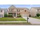 Beautiful brick home with a manicured lawn and two-car garage at 3476 Bridge Walk Drive, Lawrenceville, GA 30044