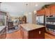 Spacious kitchen island with granite countertop in an open floor plan that leads to a cozy living room at 3476 Bridge Walk Drive, Lawrenceville, GA 30044