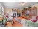 Cozy living room with a fireplace, built-in shelving unit, and comfortable seating at 3476 Bridge Walk Drive, Lawrenceville, GA 30044