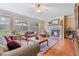 Well-lit living room with a fireplace, built-in shelving unit, and comfortable seating at 3476 Bridge Walk Drive, Lawrenceville, GA 30044