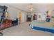 Spacious main bedroom features tray ceiling, ceiling fan, large windows, dresser, and walk in closet at 3476 Bridge Walk Drive, Lawrenceville, GA 30044